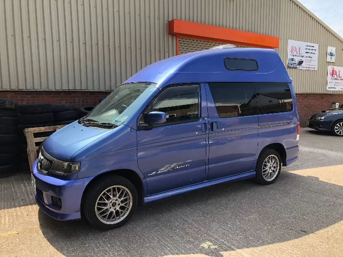 Blue van with extended roof