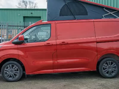 Red camper van with roof unfolded