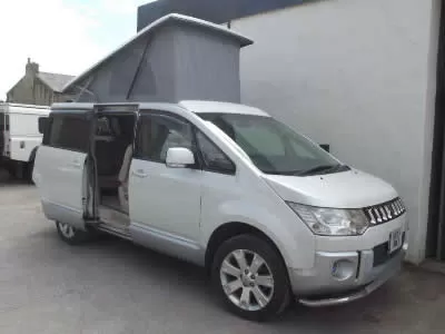 White camper with roof conversion